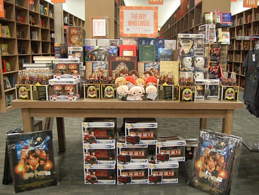 Store displays a long table with branded collectables