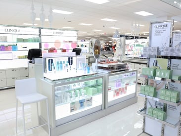 Store displaying an elegant makeup counter with high-end lotions and makeup