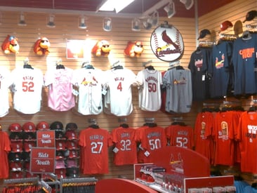 Store displaying slatwall with jerseys
