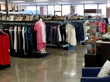 Store displays multiple rows of women's clothing rack