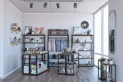 Elegant boutique with additional steel console tables and metal frame pedestals