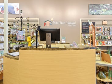 Store showing the front of register counter and table